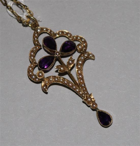 A 15ct gold, amethyst and seed pearl openwork pendant on 9ct gold chain, pendant 1.75in.